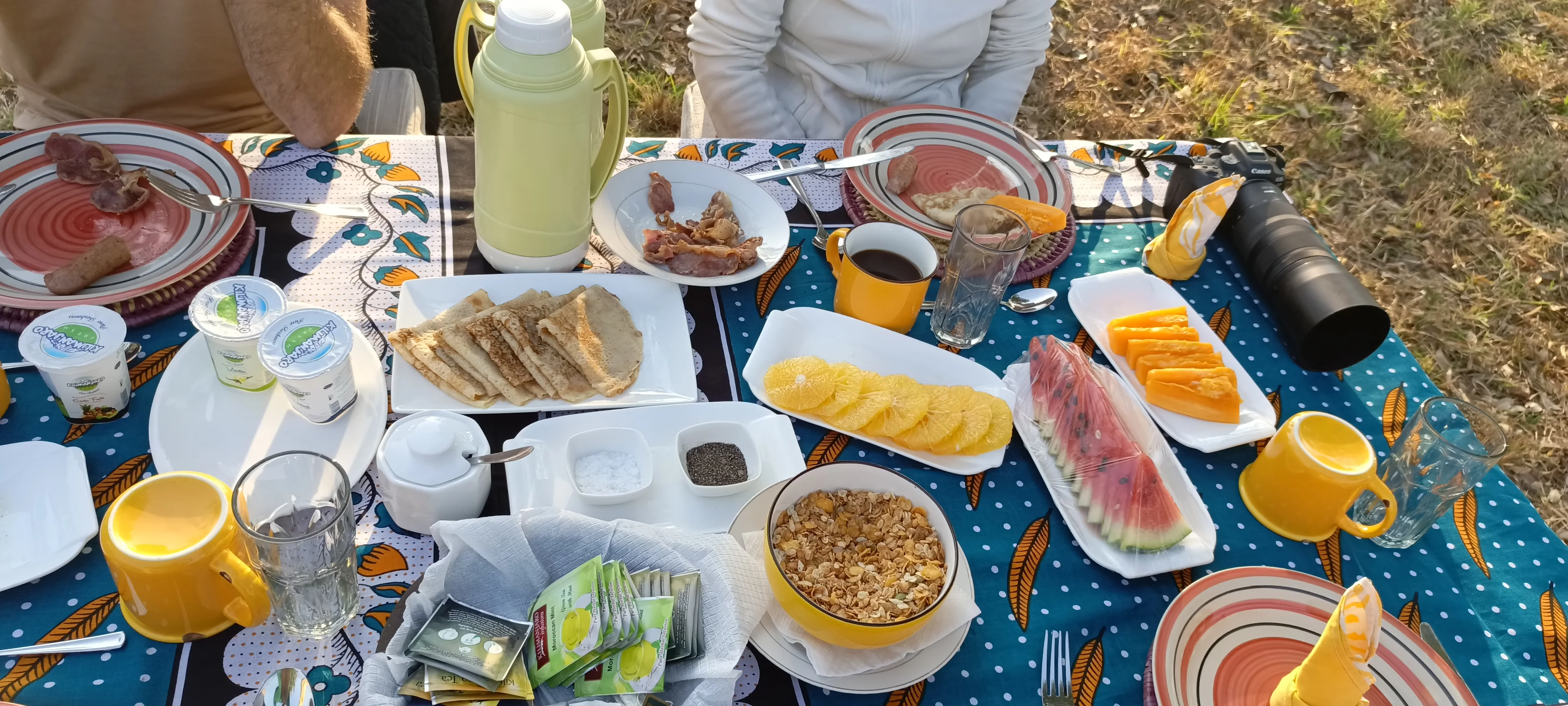 Plate of rice, salad, and sauced meat served at Nje Bush Camp